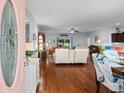 Inviting living room with hardwood floors, neutral walls, and comfortable seating at 4419 Kinlaw St., Little River, SC 29566