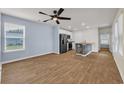 Open concept living and kitchen area featuring stainless steel appliances and plenty of natural light at 478 Samara Dr., Longs, SC 29568