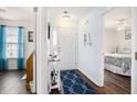 Bright hallway featuring hardwood floors, nautical decor, and access to the bedroom at 4925 Pond Shoals Ct. # 202, Myrtle Beach, SC 29579