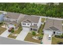 Aerial view showcasing the property's location within a well-kept neighborhood with manicured lawns and paved driveways at 5068 Wavering Place Loop, Myrtle Beach, SC 29579