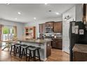 Well-equipped kitchen boasts stainless steel appliances, a functional island, and ample counter space for cooking at 5068 Wavering Place Loop, Myrtle Beach, SC 29579