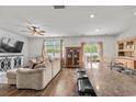 Inviting living room combines living and dining spaces, creating an open and versatile area for relaxing and entertaining at 5068 Wavering Place Loop, Myrtle Beach, SC 29579