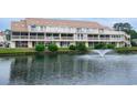 Charming condo with serene lake view featuring a fountain and multiple screened-in porches at 510 Fairwood Lakes Dr. # 17-P, Myrtle Beach, SC 29588