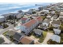 Aerial view of the condo and surrounding neighborhood near the beach and pier at 625 N Waccamaw Dr. # 107, Murrells Inlet, SC 29576