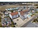 Aerial view showcases this condo and the neighborhood's proximity to the marsh at 625 N Waccamaw Dr. # 107, Murrells Inlet, SC 29576
