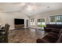 Spacious living room featuring vaulted ceilings, hardwood floors, and natural light at 630 Heartwood Dr., Conway, SC 29526