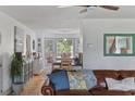 Cozy living room with leather couch, hardwood floors, and decorative furnishings at 645 Boundary Line Dr. Nw, Calabash, NC 28467