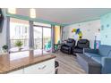 Inviting living room with a view from floor-to-ceiling windows and coastal decor at 6900 N Ocean Blvd. # 710, Myrtle Beach, SC 29572