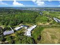 Stunning aerial view of the property, highlighting its proximity to lush greenery and waterways at 80 Landing Dr. # 80, Pawleys Island, SC 29585