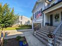 Beautiful home with landscaped front yard, brick stairs, and a welcoming front porch, great curb appeal at 80 Landing Dr. # 80, Pawleys Island, SC 29585