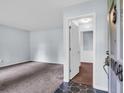 Light-filled living room with neutral paint and carpet with an entry hallway and unique tiled foyer at 1108 Chicora Blvd., Conway, SC 29526