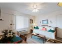 Bright living space features a comfy daybed, dining table, and large window for ample natural light at 120 Dogwood Dr. N # 209, Murrells Inlet, SC 29576