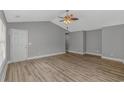 Spacious living room features vaulted ceiling, new floors, and plenty of natural light at 125 Balsa Dr., Longs, SC 29568