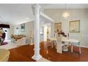 Elegant dining room featuring hardwood floors, a chandelier, and decorative columns at 202 Glenwood Dr., Conway, SC 29526