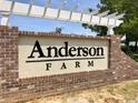 Community sign for Anderson Farm, featuring brick base, stucco, and pergola top at 2084 Nw Parow Ln Nw # E, Calabash, NC 28467