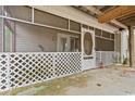 Back porch enclosed with lattice and screened door, providing bug-free outdoor enjoyment at 2776 Holly Rd., Marion, SC 29571
