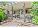 Inviting front porch with seating area, perfect for relaxing and enjoying the outdoors at 2776 Holly Rd., Marion, SC 29571