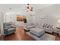 Bright living room with an open layout, seamlessly connecting to the kitchen and dining area at 3 Birdsong Ct., Murrells Inlet, SC 29576