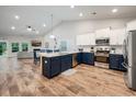 Open kitchen featuring a large island, stainless steel appliances, and modern cabinetry at 306 Southgate Ct., Pawleys Island, SC 29585