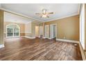 Spacious living room with hardwood floors, modern lighting, and neutral paint colors at 3565 Steamer Trace Rd., Conway, SC 29527