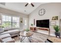 Bright living room featuring a vaulted ceiling, wood-look flooring, and contemporary decor at 364 Copperwood Loop, Conway, SC 29526