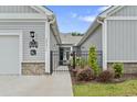 Charming facade with black metal gate and green lawn at 4027 Taranto Loop # C, Myrtle Beach, SC 29579