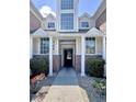 Close-up view of the townhome entrance, showing address, brick accents, and a glimpse into the interior at 4394 Daphne Ln. # F, Murrells Inlet, SC 29576