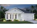 Inviting exterior view of a well-lit home with a landscaped front yard at twilight at 515 Magnolia Terrace Dr, Myrtle Beach, SC 29579