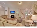 Cozy living room features a fireplace, wood flooring, and staircase, creating an inviting atmosphere at 519 Magnolia Terrace Dr, Myrtle Beach, SC 29579