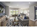 Bright and airy living room with large windows offering a view, complemented by stylish furniture and modern decor at 537 Magnolia Terrace Dr, Myrtle Beach, SC 29579