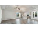 Bright living room showcasing an open floor plan to the kitchen with stainless appliances at 61 Yale Pl., Pawleys Island, SC 29585