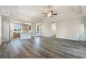 Open-concept living room featuring hardwood floors and easy access to the dining and kitchen areas at 61 Yale Pl., Pawleys Island, SC 29585