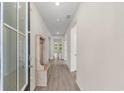 Bright entryway with a coat rack and wood-look floors at 736 Flowering Branch Ave., Little River, SC 29566