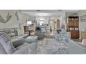 Open-concept living area with comfortable seating and bright decor at 843 Villa Dr. # 843, North Myrtle Beach, SC 29582