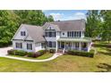 Beautiful two-story home with a covered front porch and well-maintained lawn and landscaping at 856 W Highway 9, Longs, SC 29568