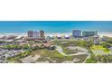 Aerial view of the condo building surrounded by a marsh with the ocean in the distance at 9501 Shore Dr. # A-211, Myrtle Beach, SC 29572