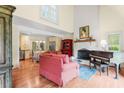 Bright and airy living room with a fireplace, hardwood floors, and large windows at 966 Waterway Ln., Myrtle Beach, SC 29572