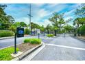 Secure gated entrance featuring a keypad and vehicle stop for residents' safety at 990 Palisade Circle, Myrtle Beach, SC 29577