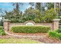 Community entrance sign, with brick facade, manicured bushes, and decorative brick base at 990 Palisade Circle, Myrtle Beach, SC 29577