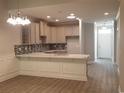 Stylish kitchen boasts modern cabinets, a mosaic backsplash, and a spacious countertop with sink at Tbd Aft Ct # 101, Murrells Inlet, SC 29576