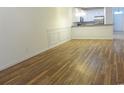 Spacious living room features hardwood flooring, wainscotting, and an open view to the kitchen at Tbd Aft Ct # 101, Murrells Inlet, SC 29576