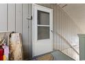 Inviting entryway featuring a white screen door and neutral-colored siding, creating a welcoming entrance at 10301 N Kings Hwy. # 10-4, Myrtle Beach, SC 29572