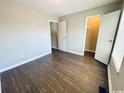 Bright bedroom with wood floors, closet, and view at 1432 Highway 544 # B2, Conway, SC 29526