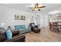 Inviting living room with comfortable seating, a ceiling fan, and seamless access to the dining area at 1622 Havens Dr., North Myrtle Beach, SC 29582