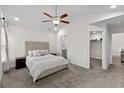 Spacious main bedroom with a walk-in closet and ensuite bathroom, featuring plush carpeting at 224 Fishburn Dr., Conway, SC 29526