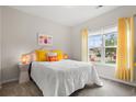 Cozy bedroom featuring a bed, window with curtains, and neutral color scheme, creating a peaceful atmosphere at 232 Red Maple Loop, Longs, SC 29568