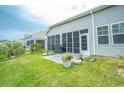 Relaxing screened-in patio with a barbecue, perfect for outdoor dining and entertaining at 251 Juniata Loop, Little River, SC 29566