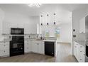 Bright kitchen featuring stainless steel appliances, modern pendant lighting, and sleek black fixtures at 2951 Mary Hines Ln., Georgetown, SC 29440