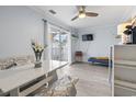 Bright dining area with a bench seat, sliding glass door, and a TV at 3008 Church St. # D3, Myrtle Beach, SC 29577