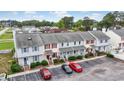 Aerial view of the townhomes showcasing parking and landscaped yards at 3008 Church St. # D3, Myrtle Beach, SC 29577